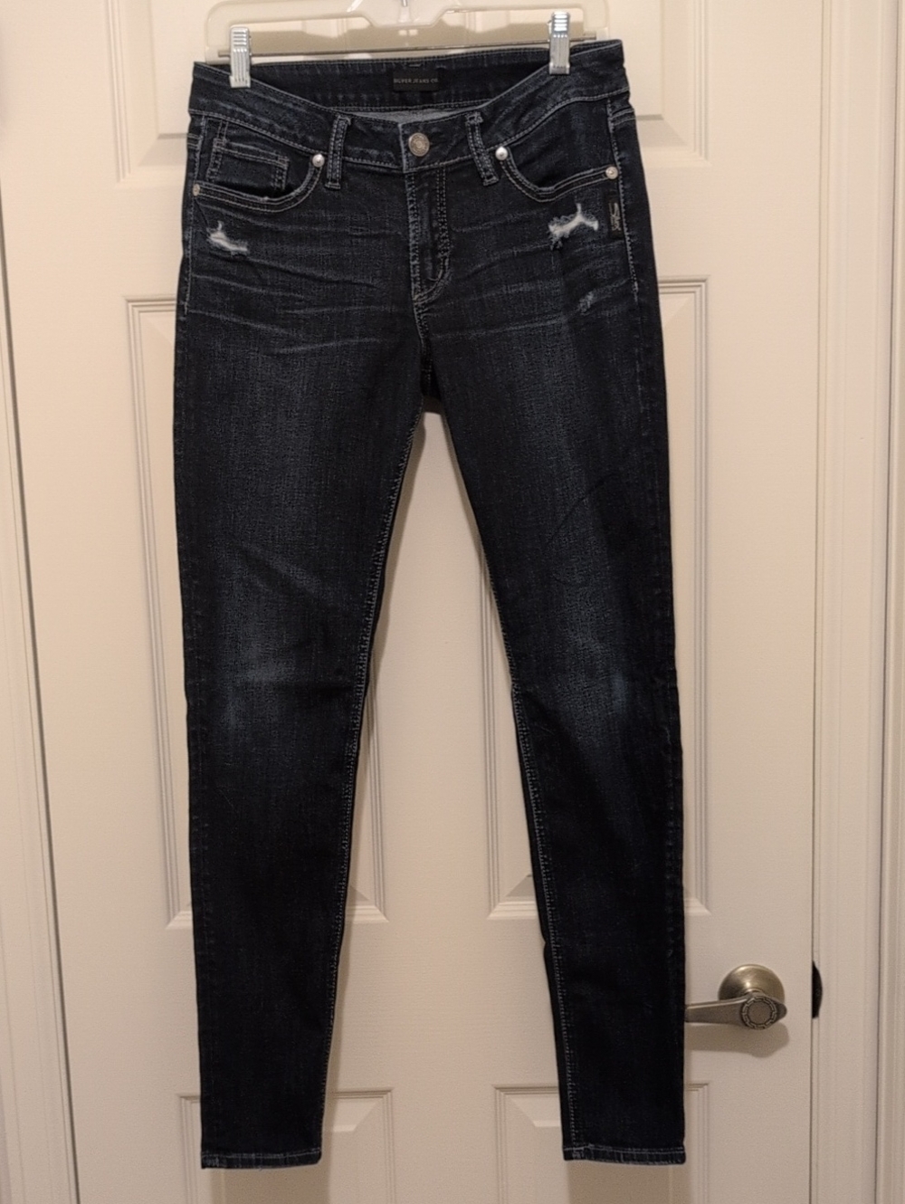 Silver Jeans Dark Wash Skinny Jeans with Light Distressing